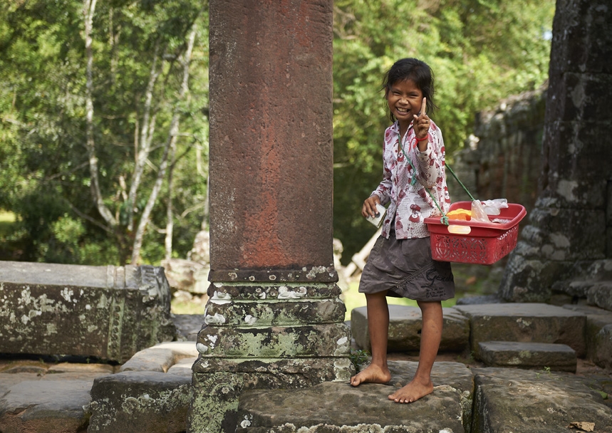 Girl laughing towards camera in Cambodia.
