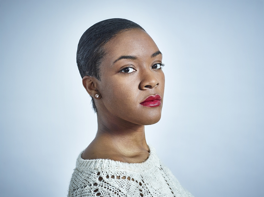 Headshot of black adult female with short hair.