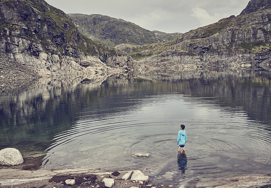 Young Male Standing in Norwegian Lake