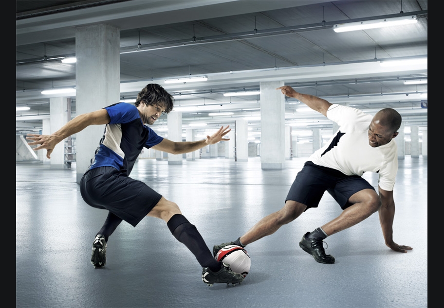 Male Footballers in underground car park