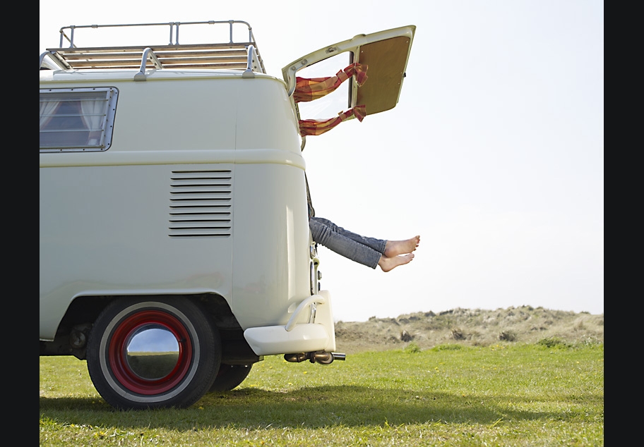 Females feet sticking out of back of Camper Van