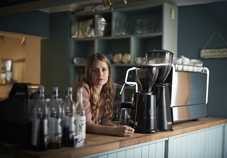 Girl Working in Cafe